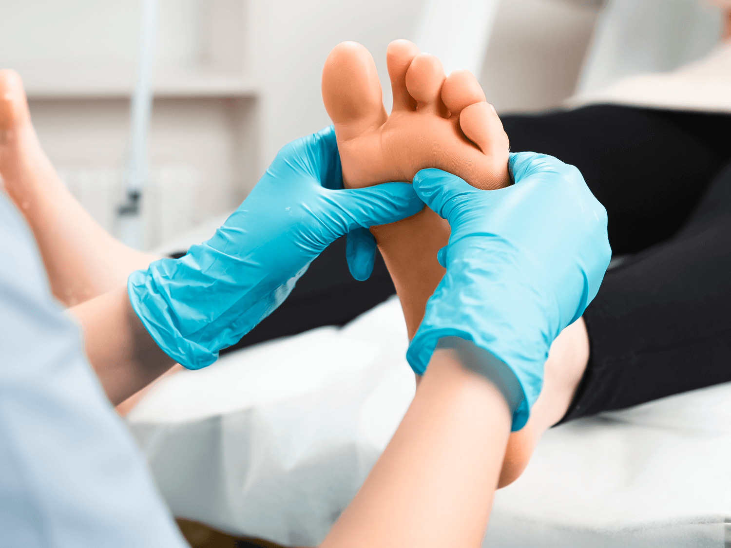 Podiatrist inspecting feet