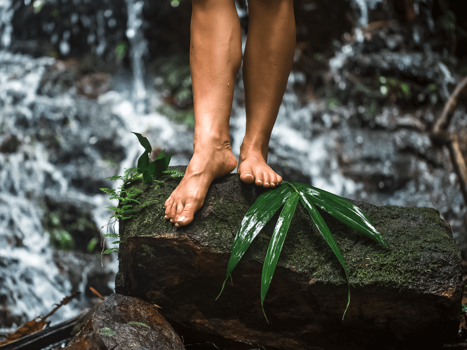 Feet standing on a rock